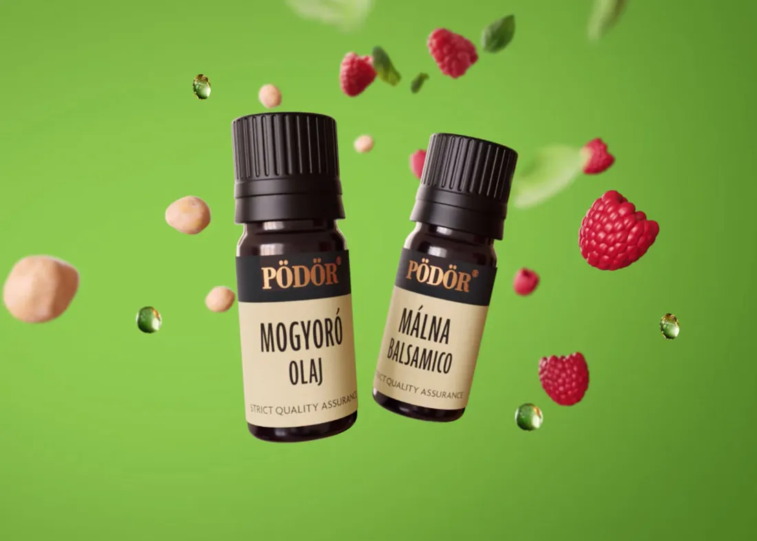 Két kis Pödör kóstolópalack mogyoróolajjal és málnaecettel, friss mogyorók és málnák között.
